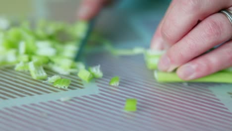 Chopping-Celery-Stalk-Into-Small-Pieces.-Close-Up