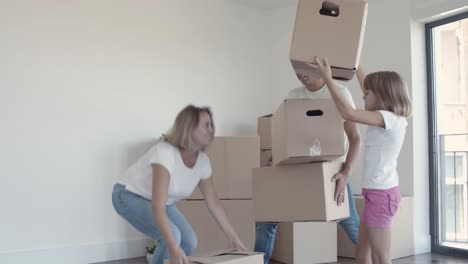 Happy-parents-and-daughter-moving-into-new-flat