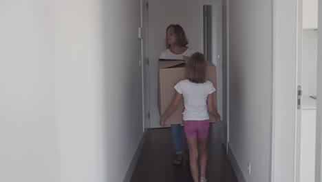 Mom-and-daughter-carrying-cartoon-box
