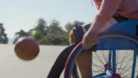 Closeup-shot-of-man-riding-in-sports-wheelchair
