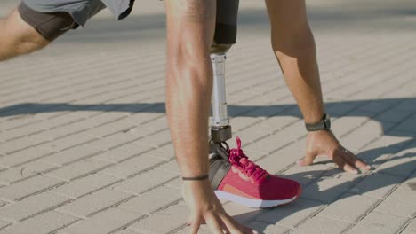 Closeup-of-man-with-prosthesis-doing-stretching-exercises.