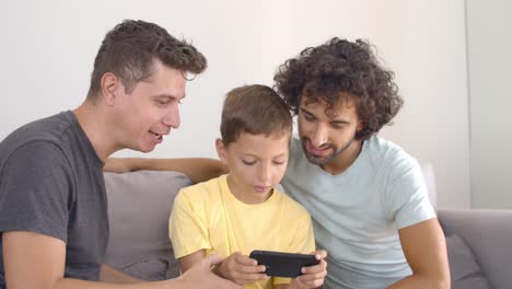 Boy-playing-online-game-on-smartphone