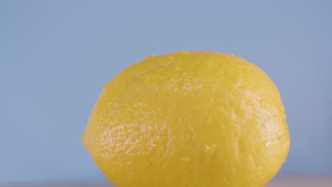 Closeup-shot-of-whole-fresh-lemon-fruit-rotating