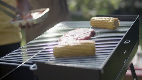 Close-up-of-hot-barbecue-grill-with-corn-and-meat