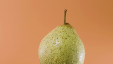 Closeup-shot-of-single-passe-crassane-pear-spinning-fast