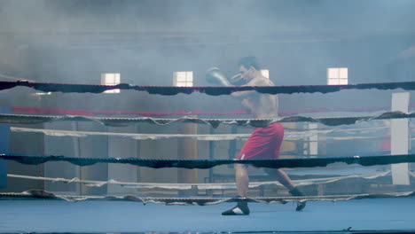 Atleta-Masculino-Fuerte-Haciendo-Pelea-De-Sombras-En-El-Gimnasio-De-Boxeo