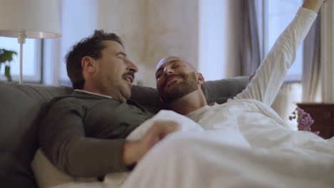 Happy-homosexual-men-waking-up-in-morning