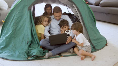 Daddy-and-kids-playing-camping-at-home