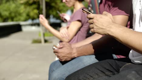Closeup-shot-of-people-using-digital-devices-on-street