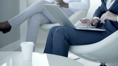 Businesswoman-typing-on-laptop-computer