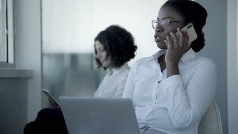 Multiethnic-businesswomen-using-digital-devices