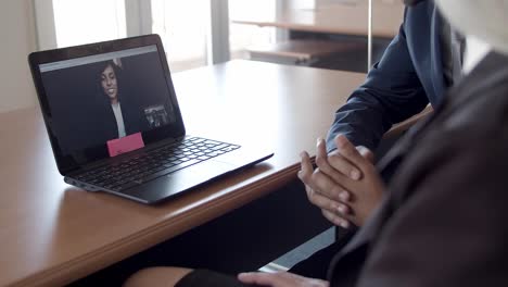 Businesswoman-talking-to-colleagues-via-video-call