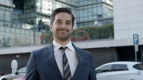 Professional-young-businessman-smiling-at-camera