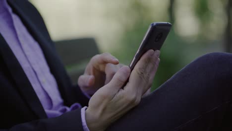 Male-hands-using-modern-smartphone