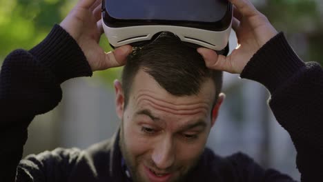 Impressed-man-taking-off-VR-glasses