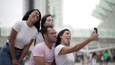 Smiling-young-people-making-facial-expressions-for-selfie