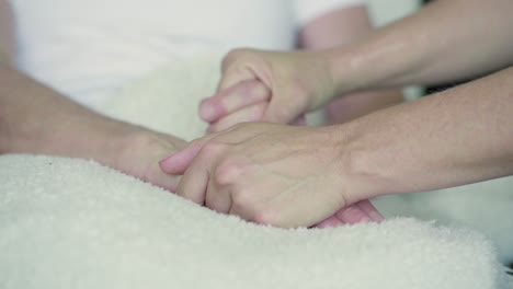 Close-up-shot-of-female-hands-caressing-one-another