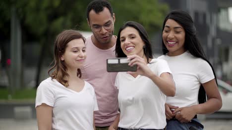 Group-of-cheerful-young-people-recording-video-message