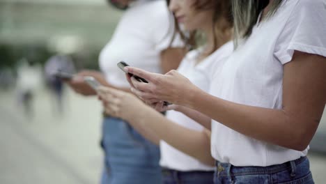 Cropped-shot-of-young-woman-using-modern-phone