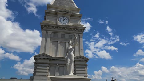 Half-orbit-shot-of-statue-atop-the-courthouse-located-in-downtown-Clarksville-Tennessee