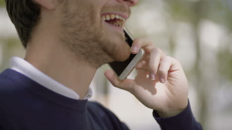 Happy-bearded-man-talking-by-mobile-phone
