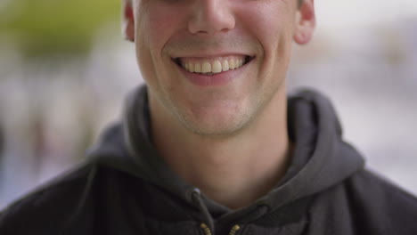 Cropped-shot-of-cheerful-young-man-laughing