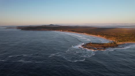 Angourie-Back-Beach-And-Angourie-Point-Beach-At-Sunset-In-NSW,-Australia---aerial-shot
