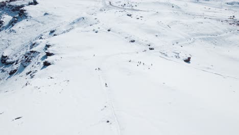 Aerial-View-Of-Skiers-Over-Steep-Snow-Covered-Mountains-At-The-Farellones-Ski-Resort-Near-Santiago,-Chile