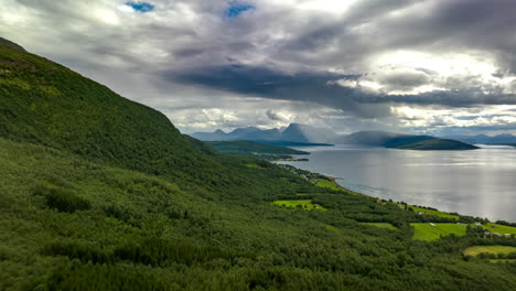 Dramatic-Nature-Scene-Of-Cloudy-Sky-Over-Greenery-Lake-Mountains-At-Malangen-Fjord-In-Northern-Norway