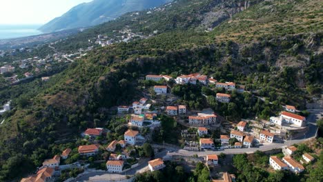 Ionian-Coastal-Splendor:-Touristic-Villages,-Azure-Sea,-and-Picturesque-Mountain-Roads-Along-the-Stunning-Albanian-Coastline