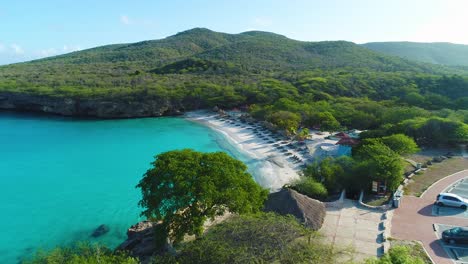 Drone-overview-of-Grote-Knip,-empty-beach-and-parking-lot-on-island-of-Curacao