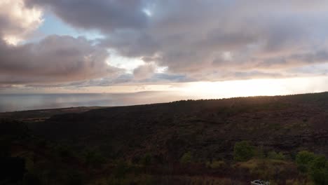 Aerial-wide-rising-shot-of-the-island-of-Ni'ihau-from-the-southern-coast-of-Kaua'i-at-sunset-in-Hawai'i