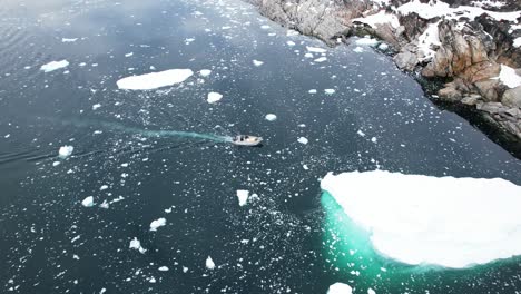 Expedition-vessel-in-freezing-ocean-of-Greenland,-aerial-view
