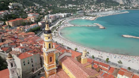 Bell-tower-of-Saint-Michel-Church-in-Menton,-France-Drone-,-aerial-,-view-from-air