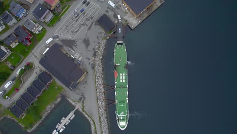Aerial-birdseye-view-of-cars-being-loaded-onto-the-ferry-at-Gryllefjord-after-waiting-hours-due-to-the-high-demand