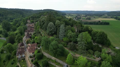Ascending-drone,aerial--Limeuil-village-Dordogne-France