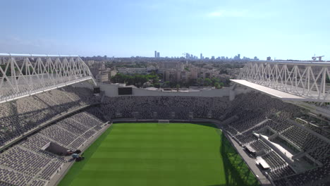 Flying-over-the-empty-Bloomfield-football-Stadium-amazing-engineering-and-finest-grass-Jaffa-Tel-Aviv,-the-Stadium-renovated-for-3-years-and-It-is-the-home-of-three-clubs