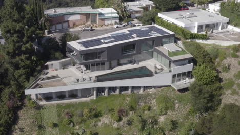 Aerial-pull-in-over-modern-Beverly-Hills-mansion-on-Arby-Drive