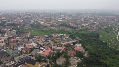 Aerial-view-neighbourhood-in-Lagos-Nigeria-on-a-hazy-day-with-green-vegetation-beside-the-neighbourhood