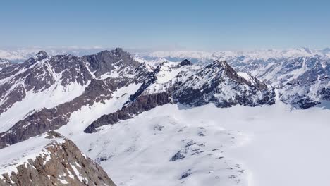Beautiful-cinematic-aerial-of-snowy-alpine-mountain-glacier-peaks