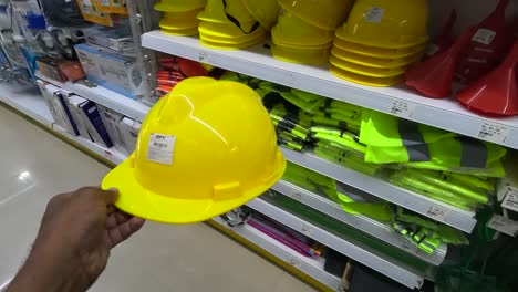 POV-shot,-a-customer-is-shopping-for-industrial-safety-gear-at-a-super-market