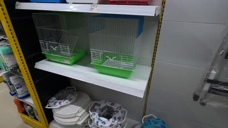 POV-shot,-customer-buying-bird-cage-from-supermarket