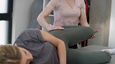 Female-physical-therapist-helping-her-patient.