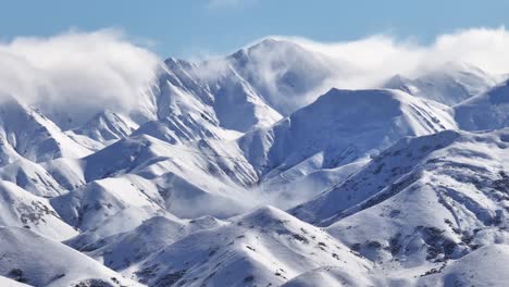 Breathtaking-mountain-alpine-scenery,-fresh-winter-snow-on-high-peaks
