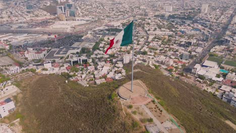 Mexican-flag-in-a-windy-day-in-a-north-mexican-city-going-up