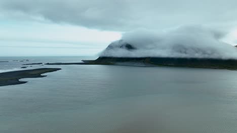 Brunnhorn-Mountain-Covered-In-Clouds-In-East-Iceland---aerial-drone-shot