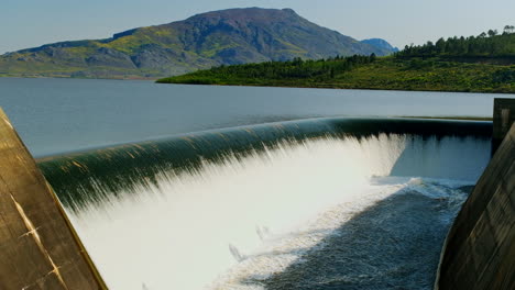 Theewaterskloof-dam-spillway-with-water-cascading-over,-flooding-control