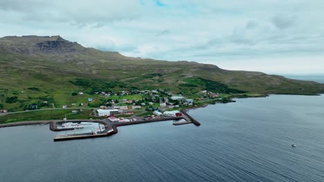 Aerial-View-Of-Stodvafjordur-Fishing-Village-During-Cloudy-Day-In-East-Iceland