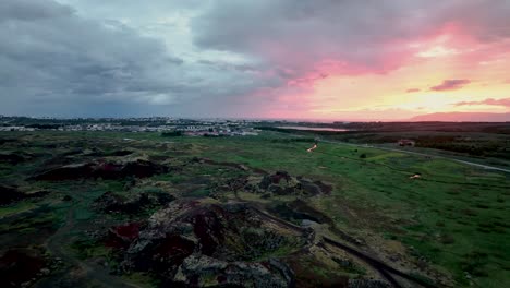 Scenic-Sunset-Over-Suburbs-Of-Reykjavík-In-Iceland---aerial-drone-shot