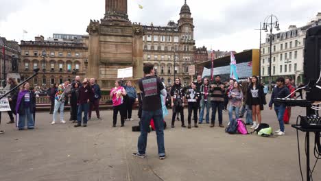 Wide-shot-of-a-performer-entertaining-trans-supporters-in-Glasgow